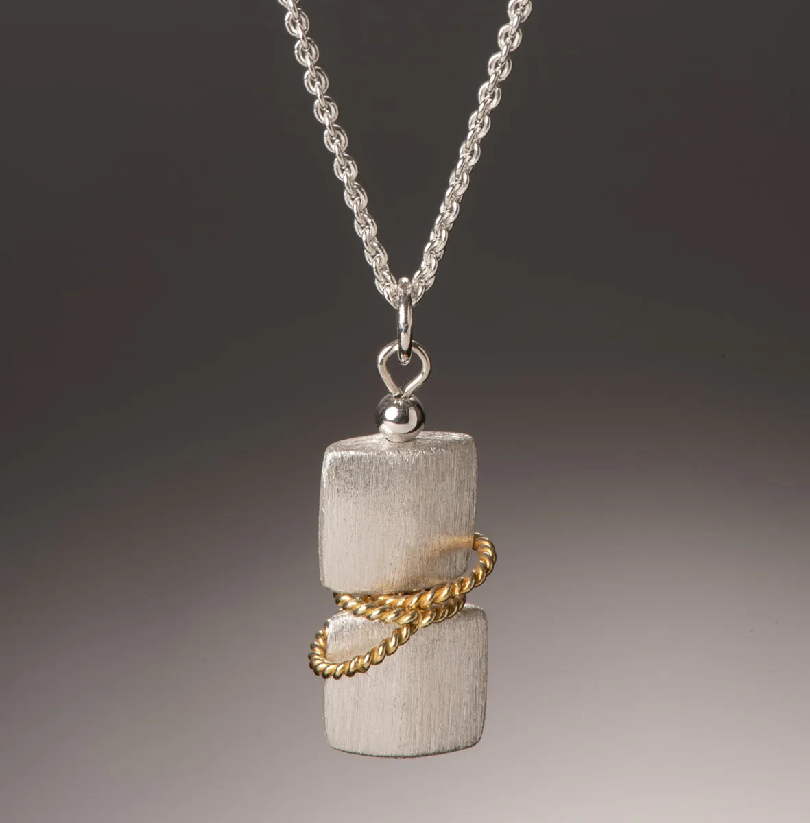 duo twist v pendant