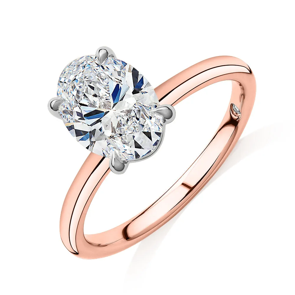 Signature Simulant Diamond 2.00 carat* oval solitaire engagement ring in 14 carat rose and white gold